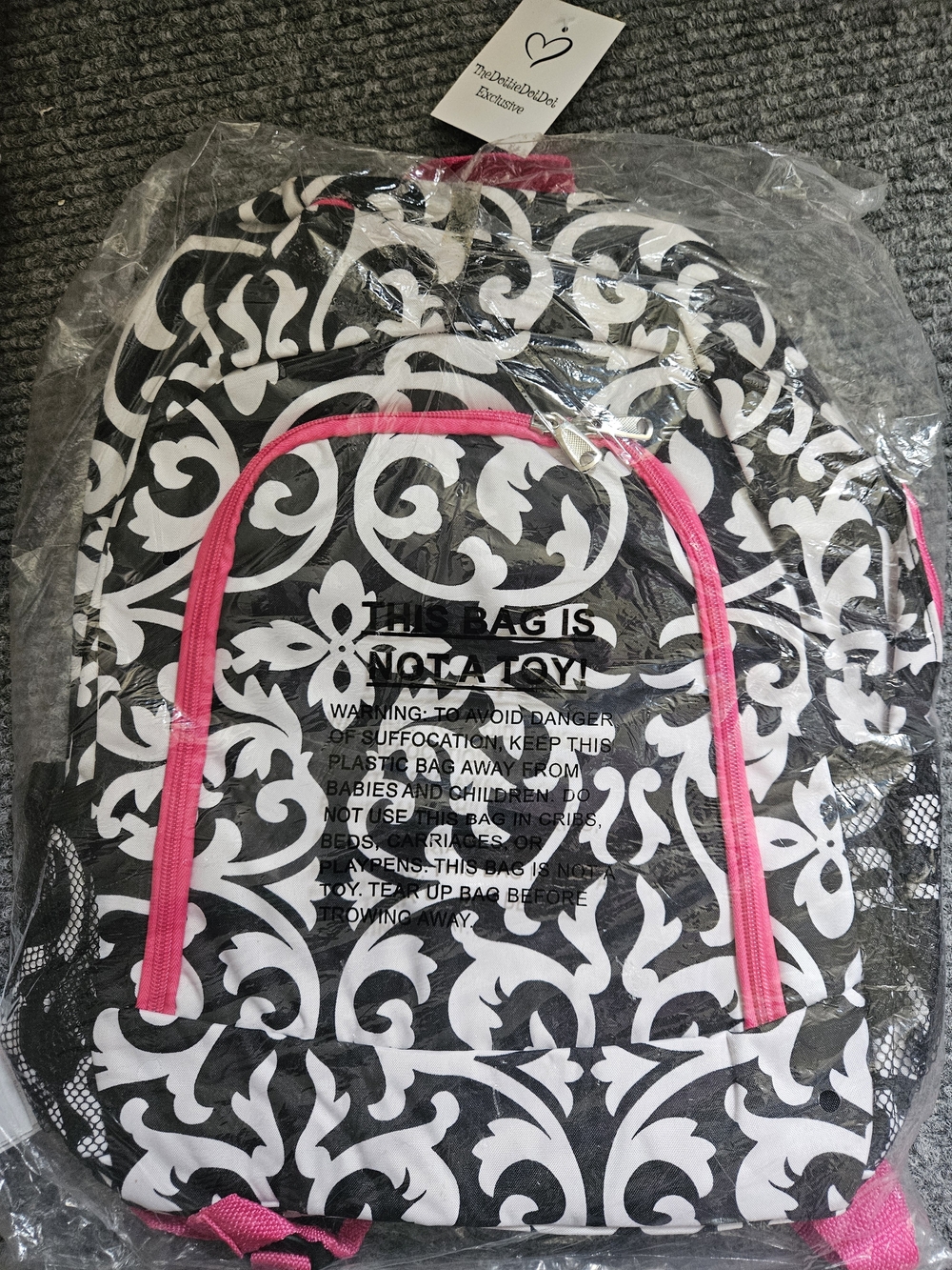 Stylish Black & White Damask Backpack with Pink Accents. Full Size